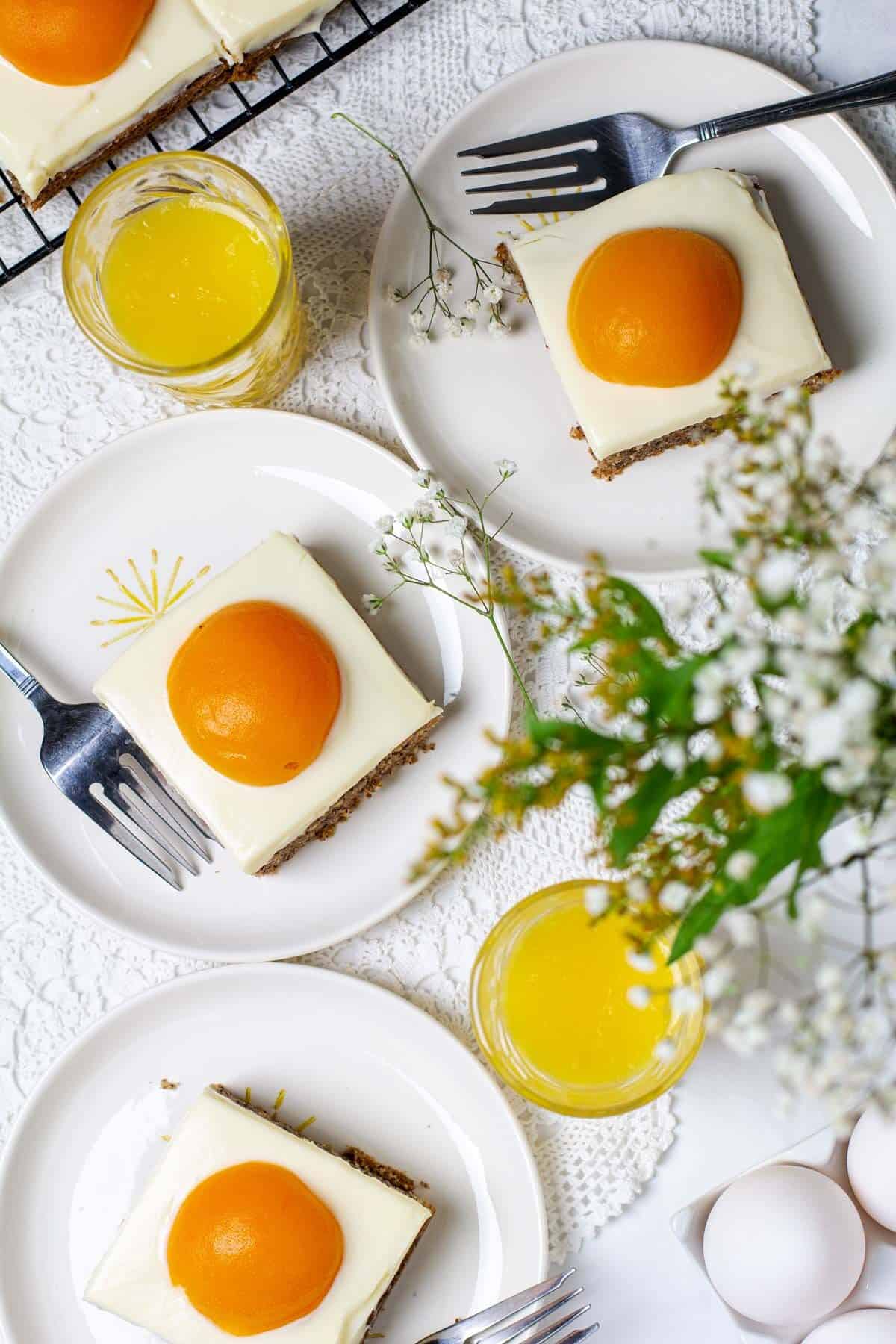 Overhead photo of fried egg cake servings on a spring-decorated table.