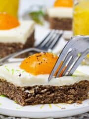 A close up of a fork cutting into the Spiegeleierkuchen.