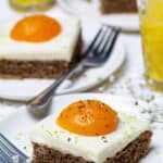 Close up of fried egg cake with fake salt and pepper on the "yolk."
