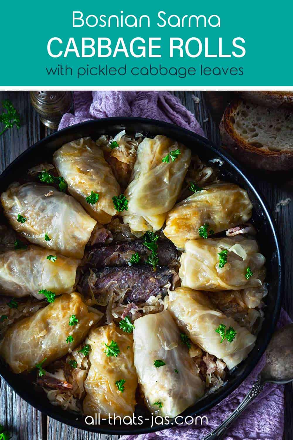 Cabbage rolls placed in a circle with smoked meat in the middle with text overlay.