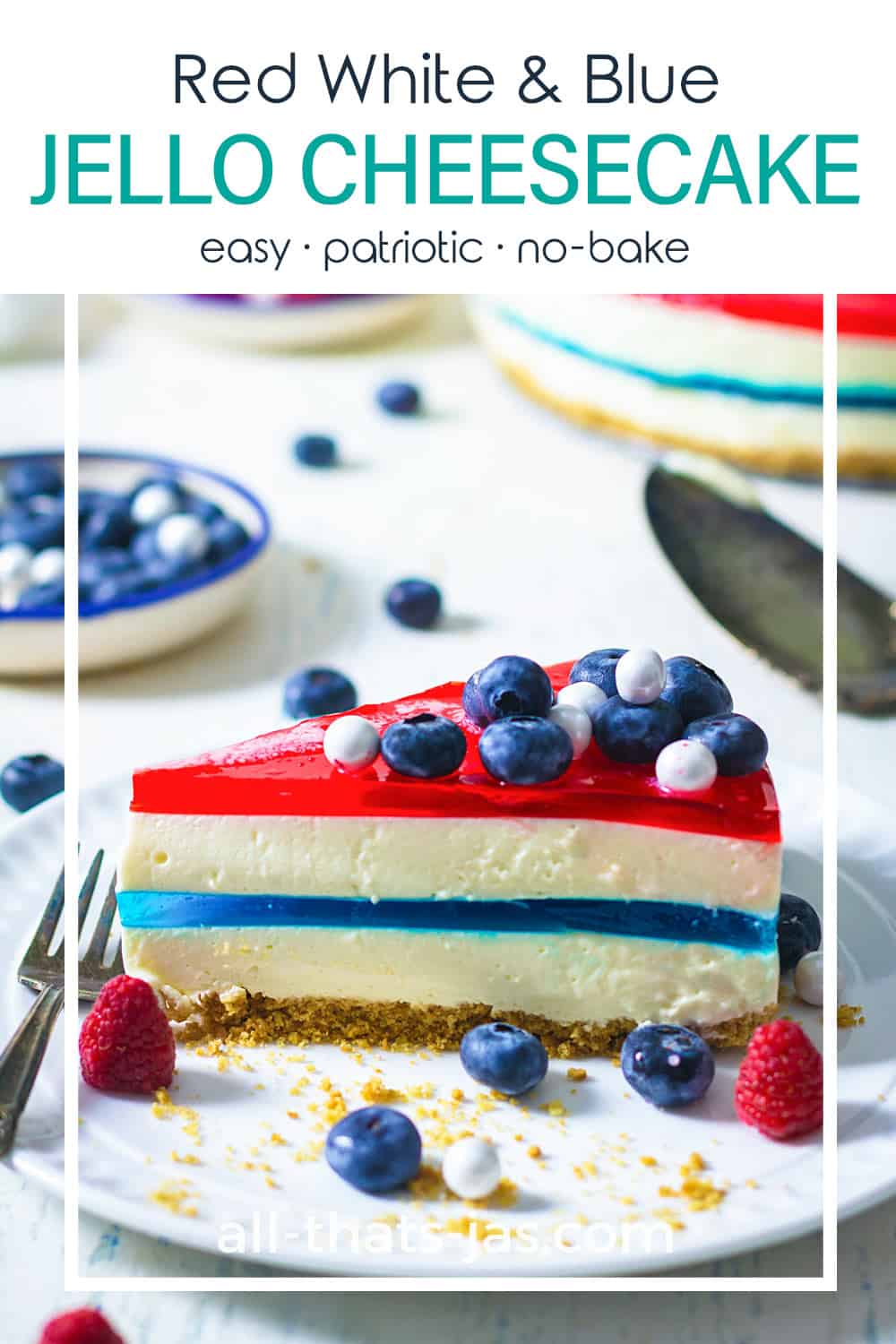 A close up of the cheesecake showing the blue middle jello layer and the red top jello layer with blueberries on top with text overlay.