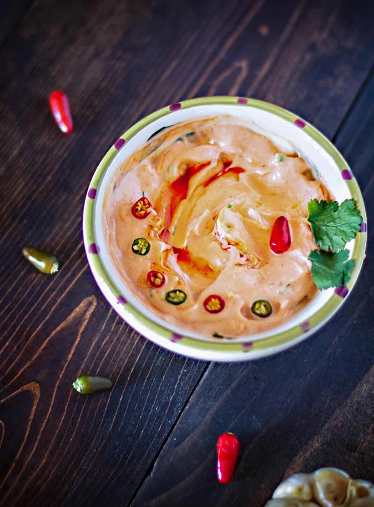 Hot pepper and cilantro aioli sauce in a bowl.