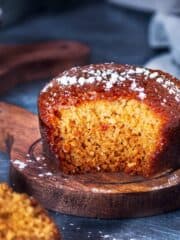 A square photo of pudding cake cut to show its interior texture.