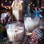 Glasses with homemade baileys on a festive Christmas table.