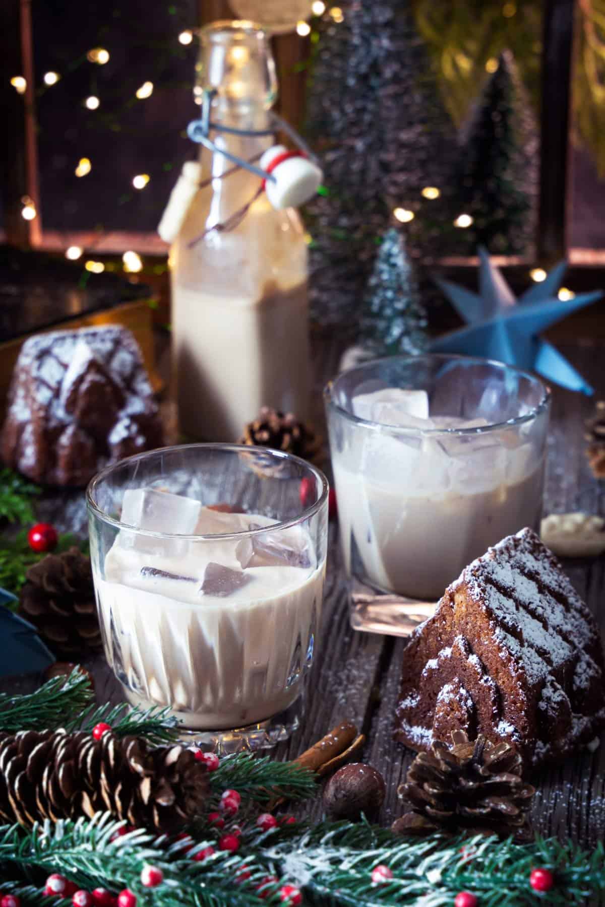 Glasses with homemade baileys on a festive Christmas table.