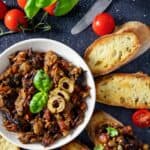 Toasted bread with eggplant caponata appetizer.