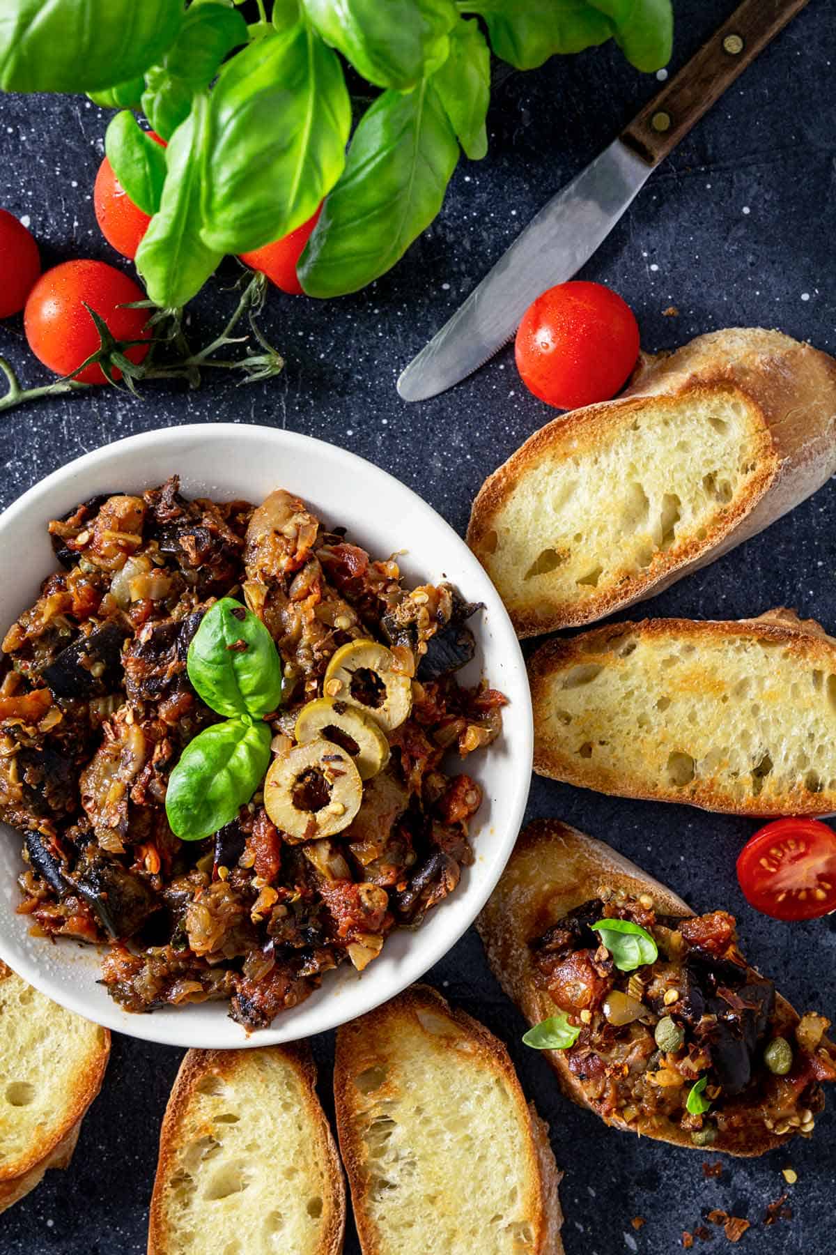Toasted bread with eggplant caponata appetizer.