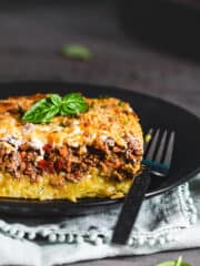 A serving of polenta casserole showcasing its layers.