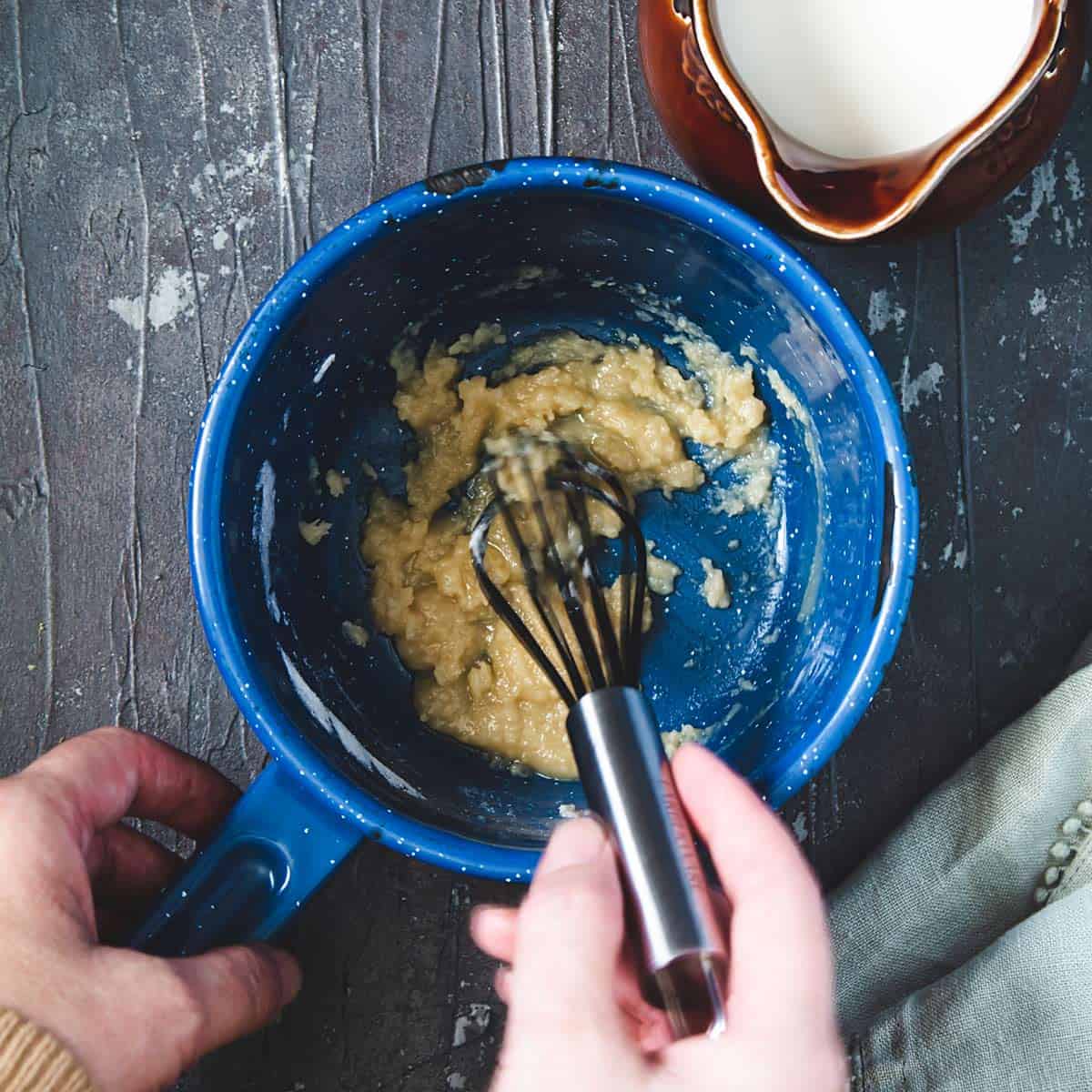 Cooking flour in butter for the white sauce.