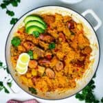 Pork and sausage risotto in a Dutch oven on the table.