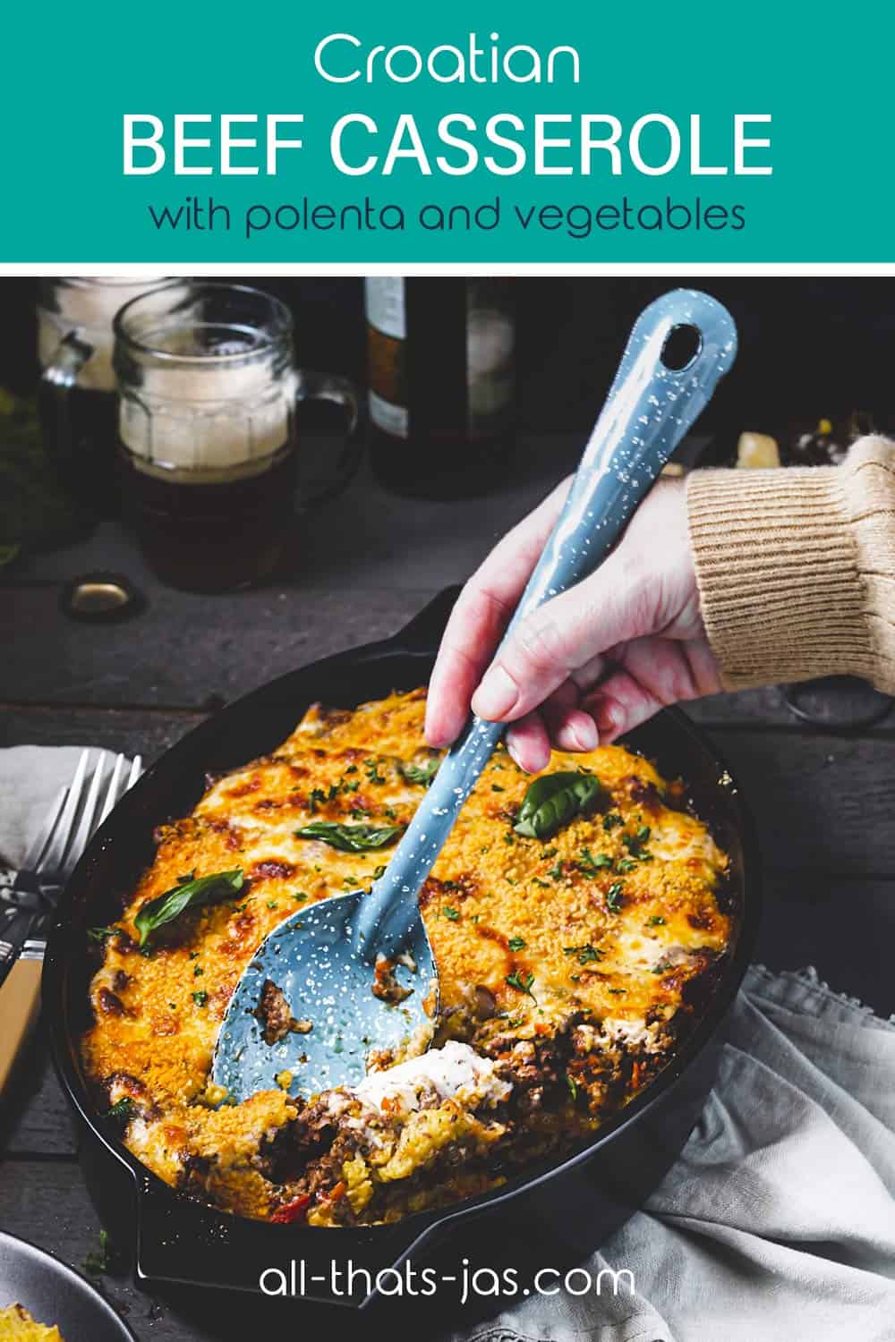 A person scooping casserole with a spoon with text overlay.