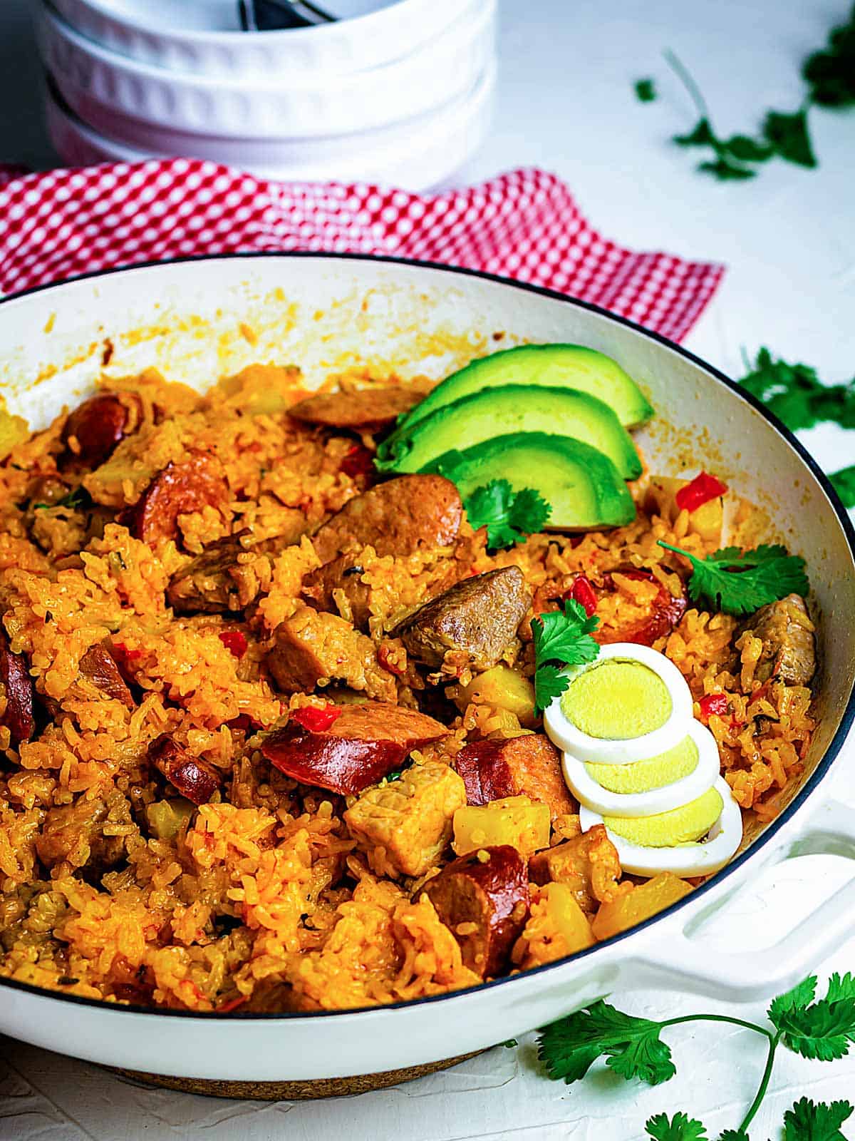 A closeup of the creamy Colombian-style rice dish with sausage and pork.
