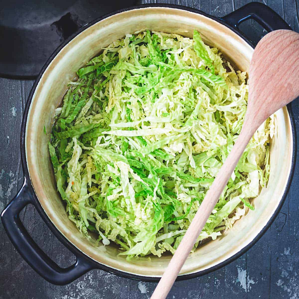 Shredded savoy cabbage in a pot. 