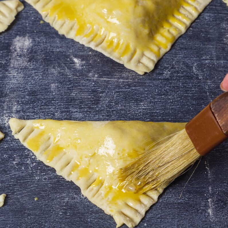 Cheese pastries brushed with egg wash. 