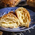 Sliced cheese borekas showing the filling and puff pastry flaky layers.