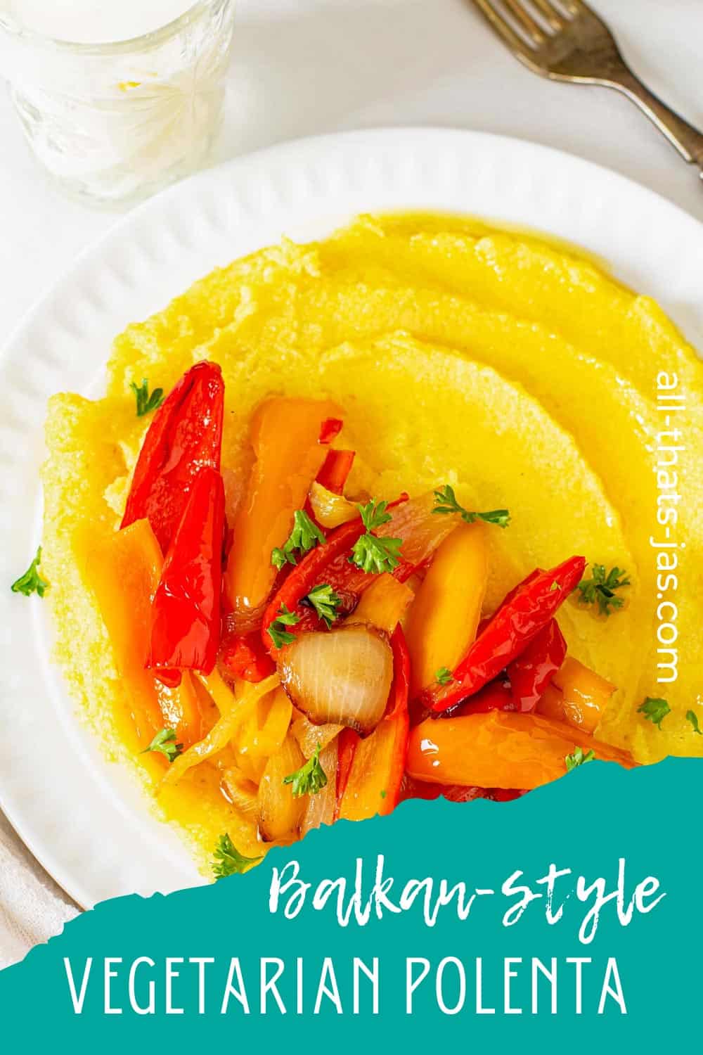 A close up image of soft polenta with roasted yellow and red bell peppers and onions with text overlay.