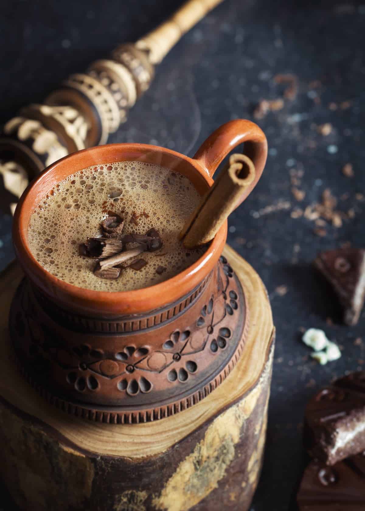 A close up of the hot chocolate drink with cinnamon.