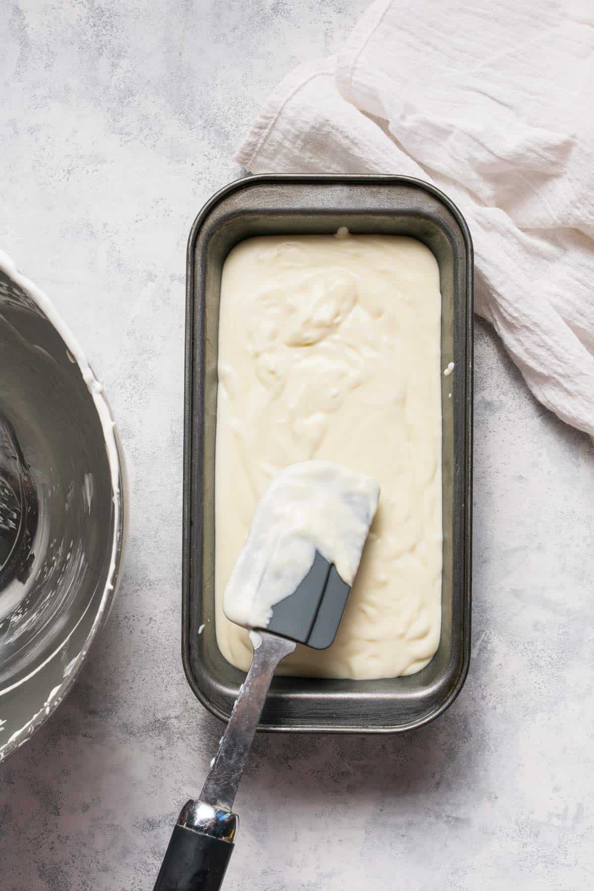 Tequila-infused no-churn ice cream in a container ready for freezing.