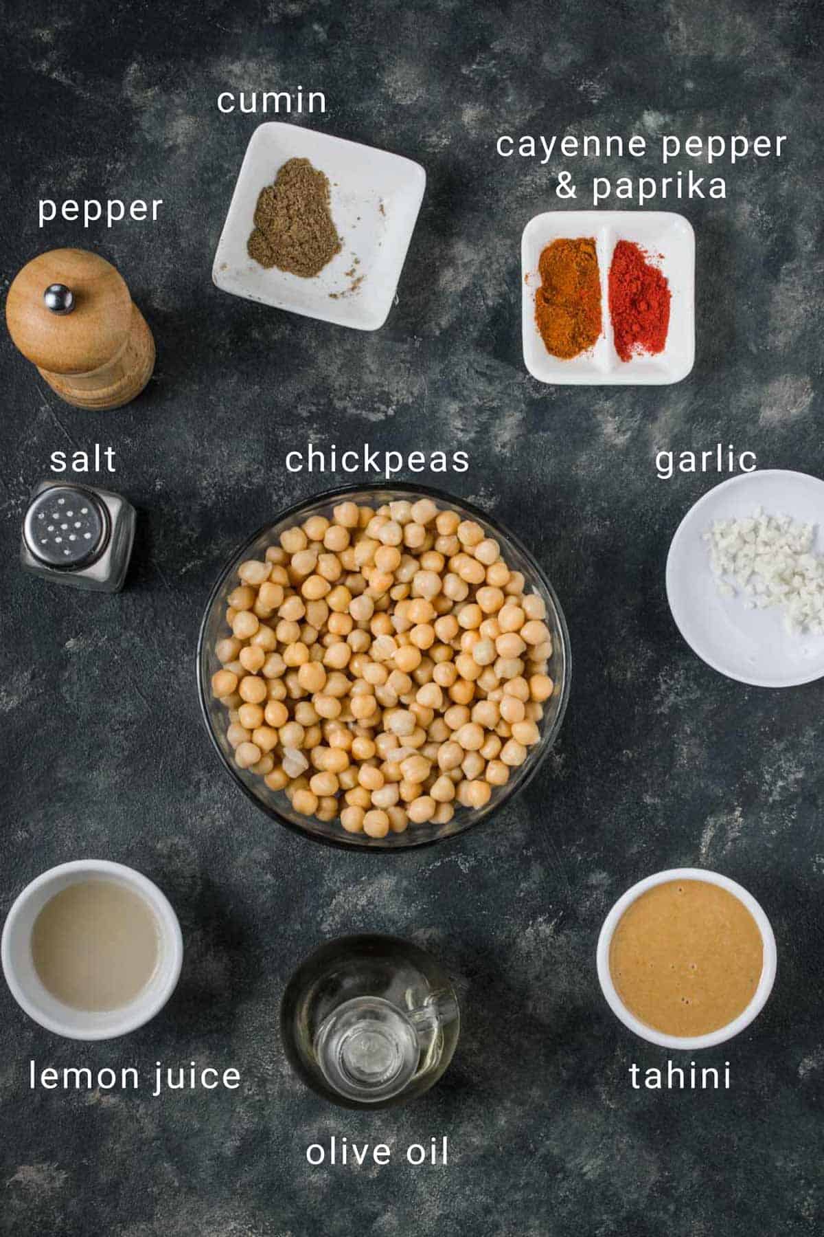 Ingredients for garlic hummus on a table.