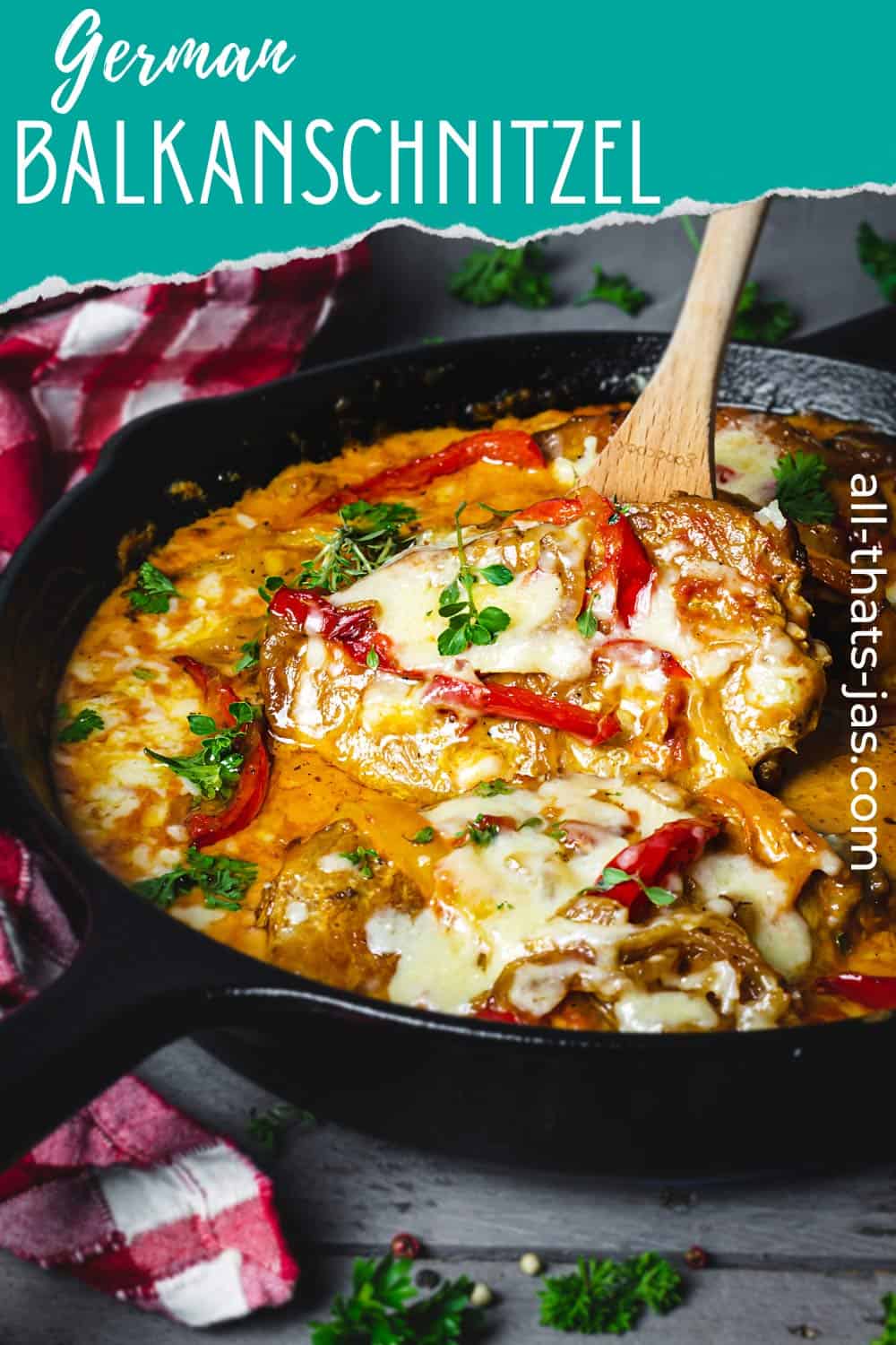 German pork schnitzel in creamy bell pepper sauce with a wooden spoon and text overlay.