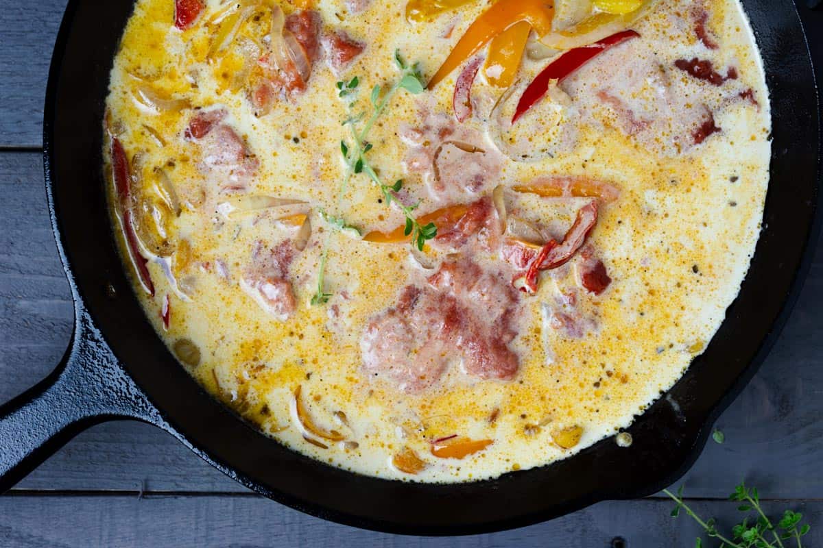 Creamy pepper sauce simmered in a skillet.